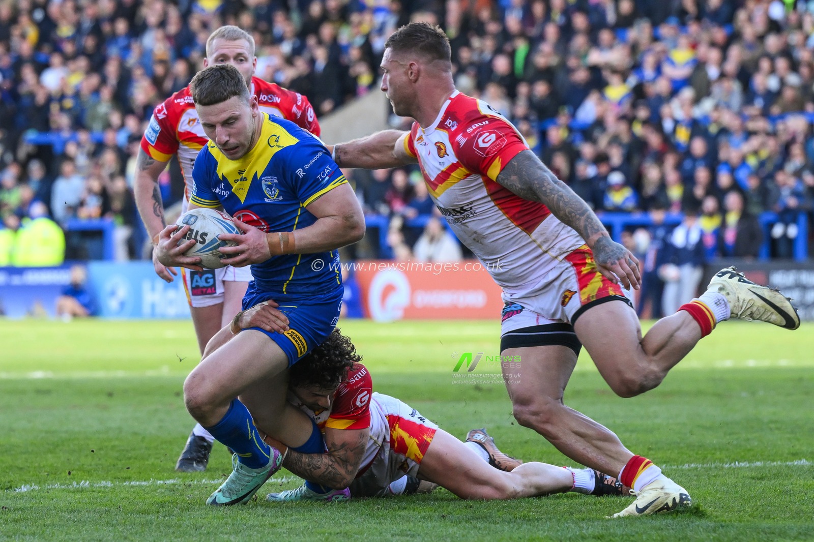 George Williams of Warrington Wolves is tackled by Arthur Romano of Catalan Dragons during the Betfred Super League match Warrington Wolves vs Catalans Dragons at Halliwell Jones Stadium, Warrington, United Kingdom, 30th March 2024

(Photo by Craig Thomas/News Images)