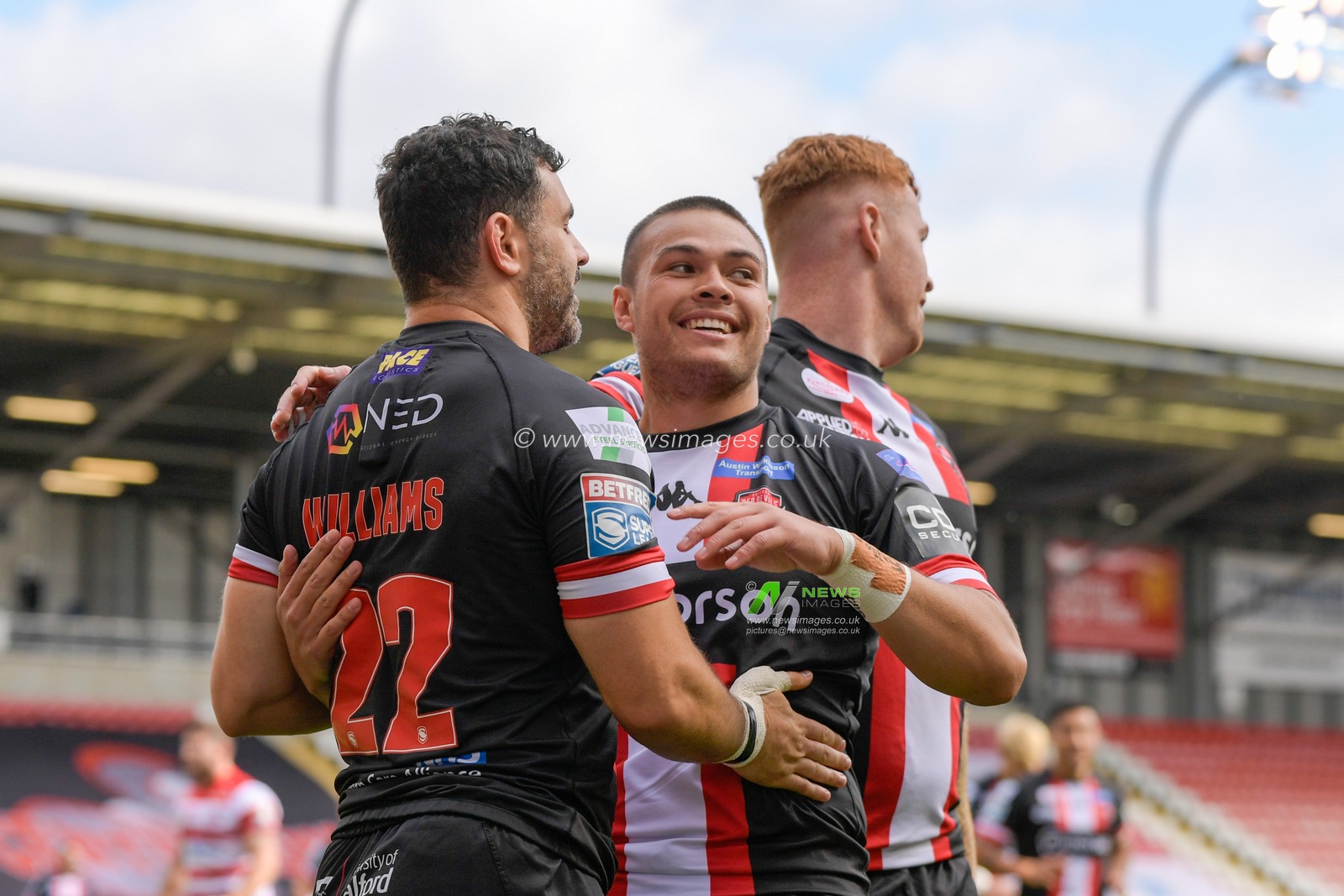 Rhys Williams (22) of Salford Red Devils celebrates scoring a try to make it 0-4