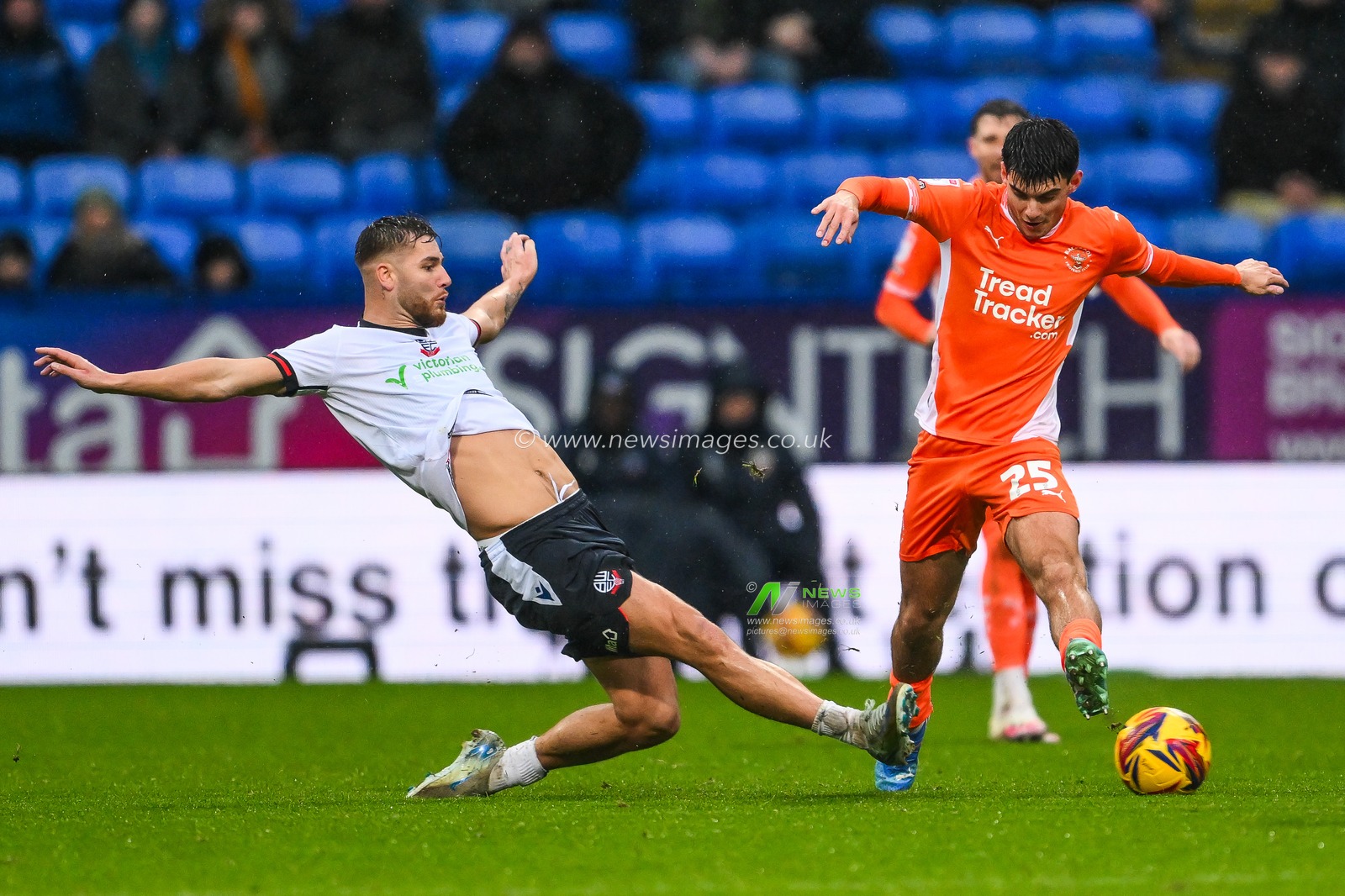 Rob Apter of Blackpool is tackled by John McAtee of Bolton Wanderers during the Sky Bet League 1 match Bolton Wanderers vs Blackpool at Toughsheet Community Stadium, Bolton, United Kingdom, 23rd November 2024

(Photo by Craig Thomas/News Images)