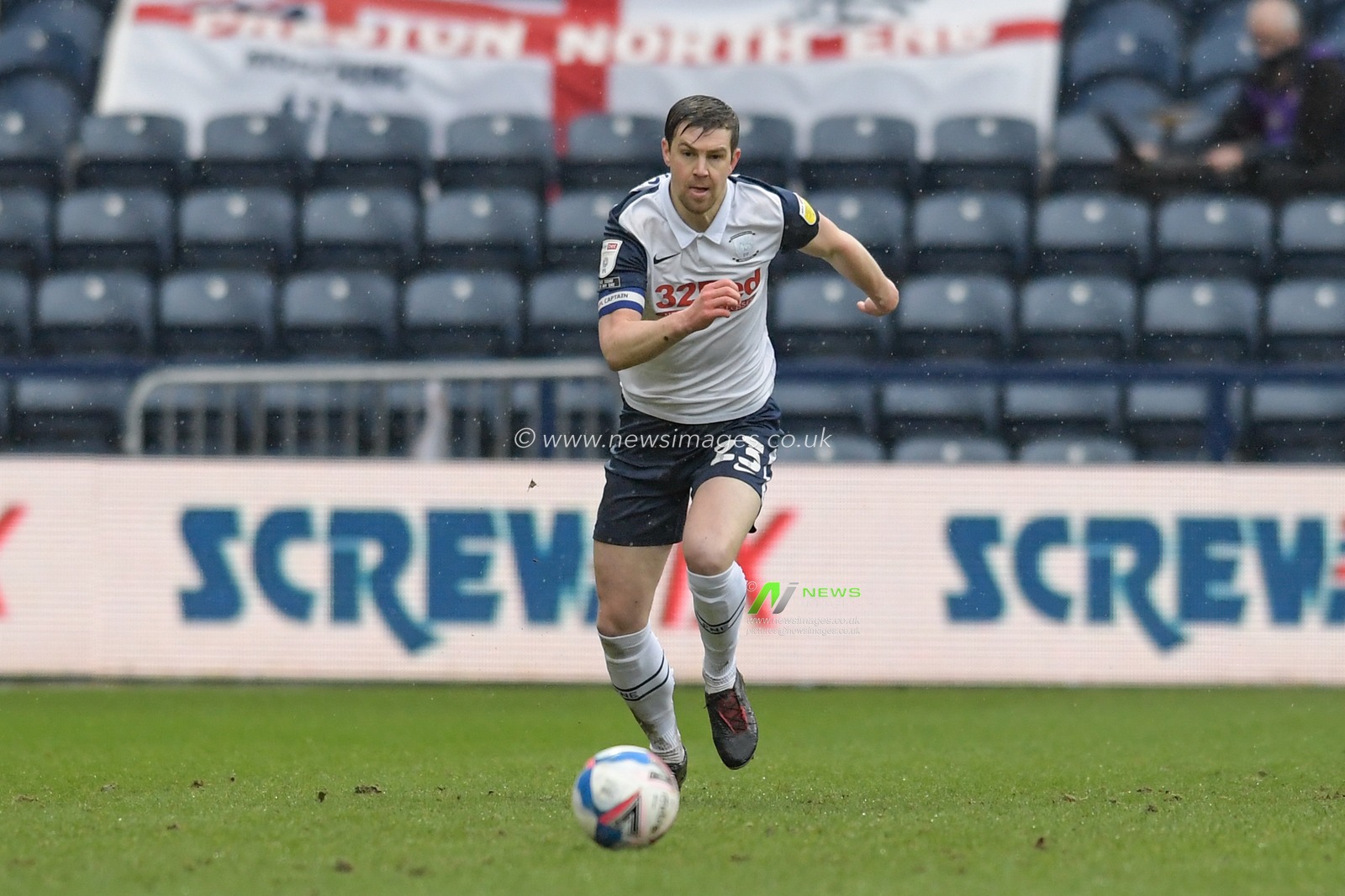 Paul Huntington #23 of Preston North End runs forward with the ball