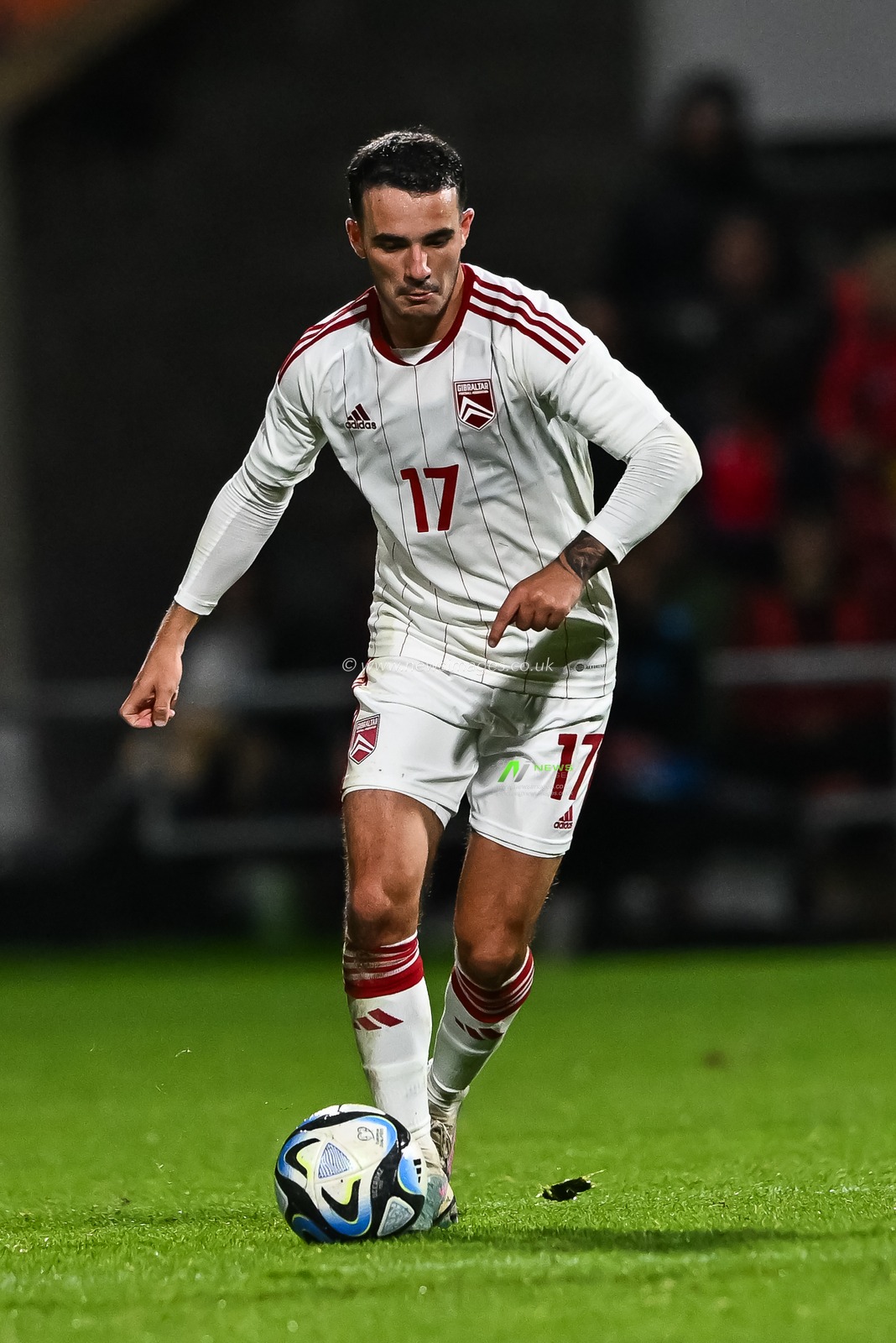 Kian Ronan of Gibraltar makes a break with the ball during the International Friendly match Wales vs Gibraltar at SToK Cae Ras, Wrexham, United Kingdom, 11th October 2023

(Photo by Craig Thomas/News Images)