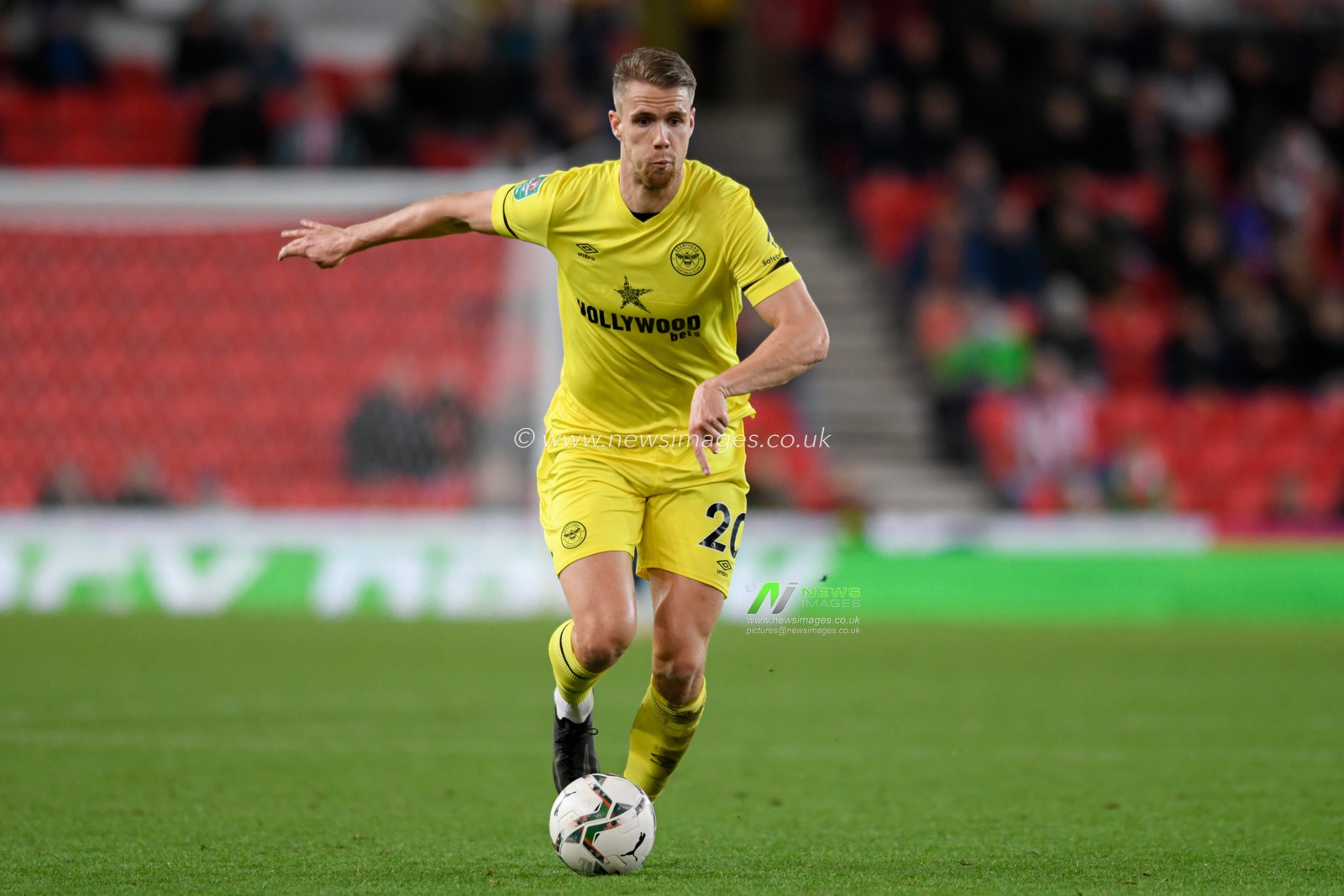 Kristoffer Ajer #20 of Brentford runs forward with the ball