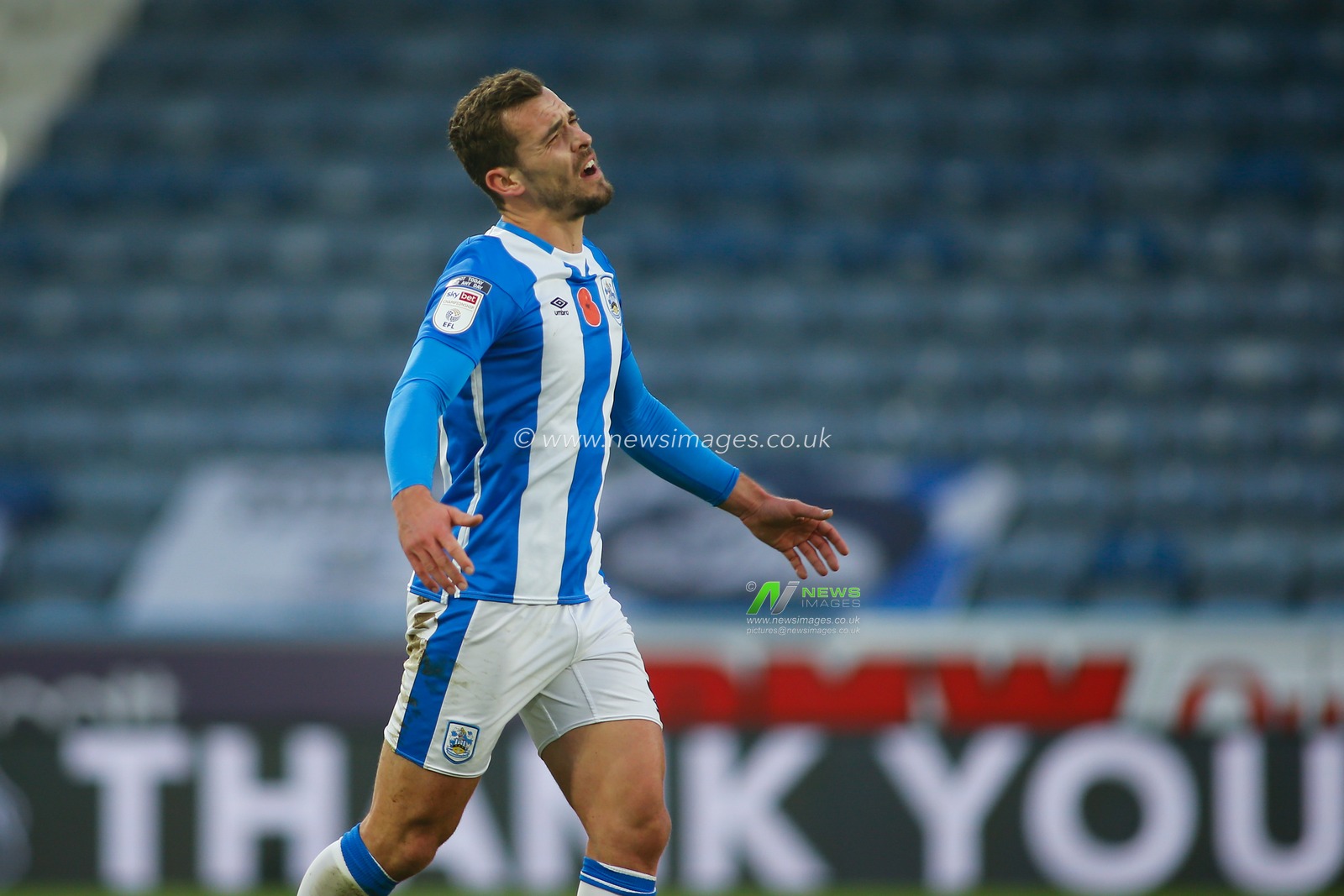 Harry Toffolo #3 of Huddersfield Town  shows his frustration  towards match referee Oliver Langton.