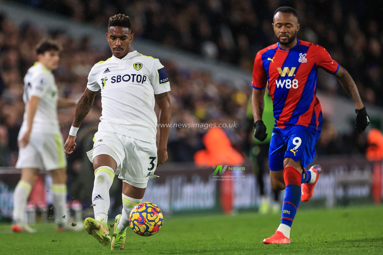 Junior Firpo #3 of Leeds United passes the ball back