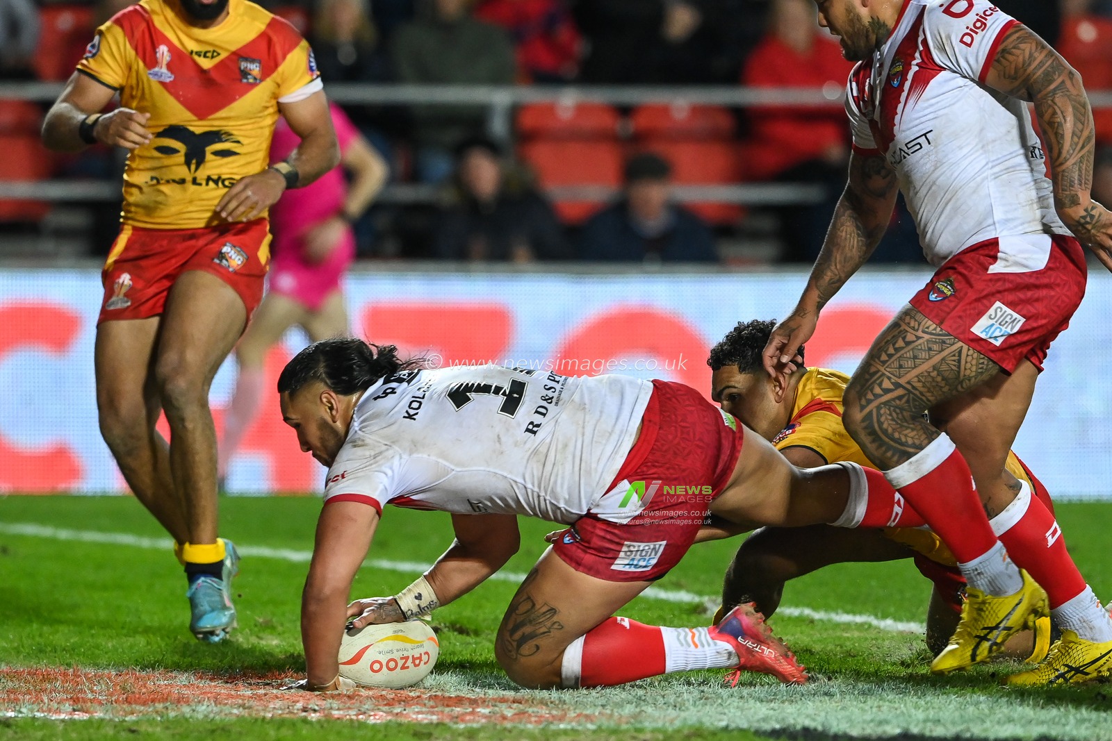 Keaon Koloamatangi of Tonga scores a try during the Rugby League World Cup 2021 match Tonga vs Papua New Guinea at Totally Wicked Stadium, St Helens, United Kingdom, 18th October 2022

(Photo by Craig Thomas/News Images)