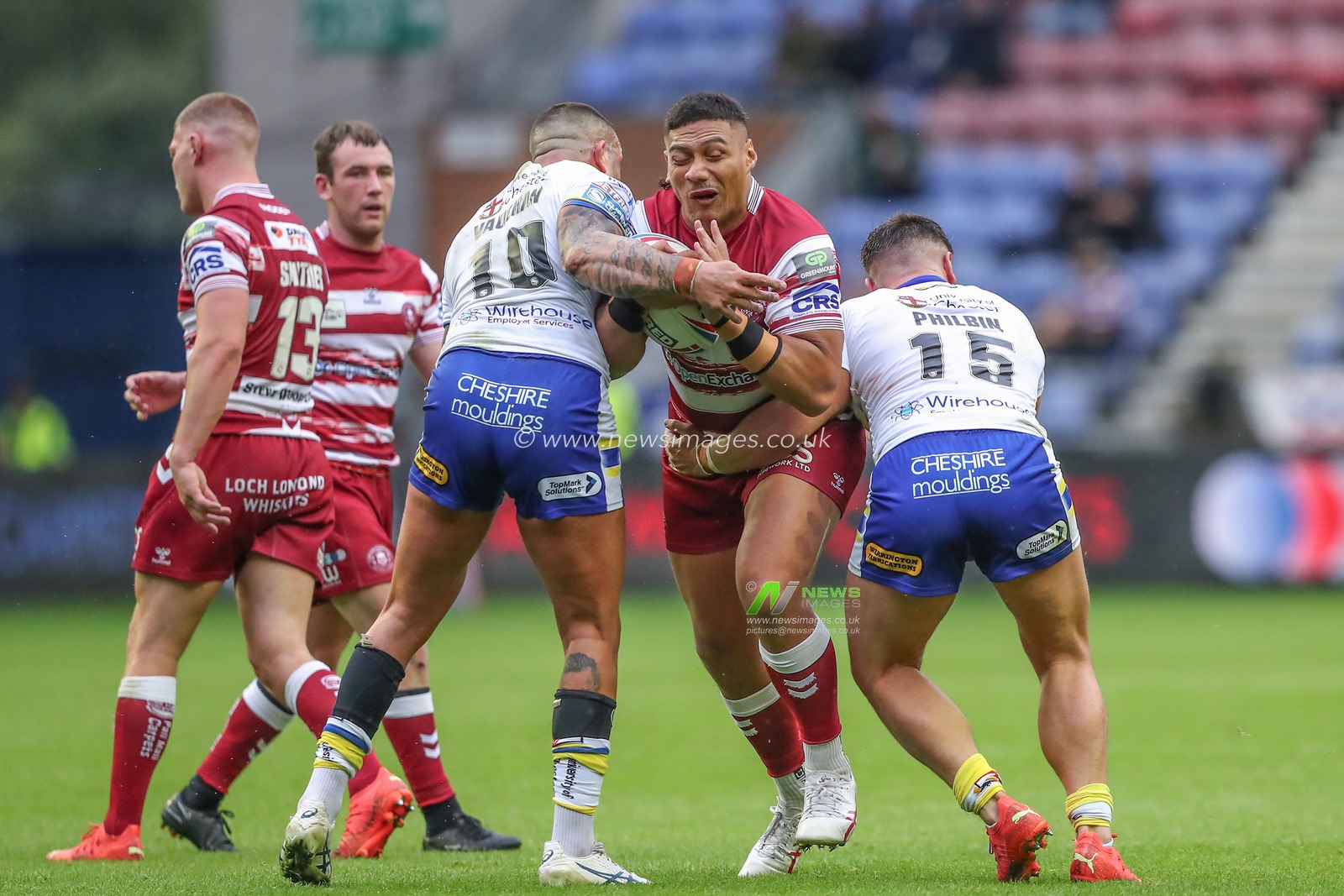 Patrick Mago #20 of Wigan Warriors is tackled during the Betfred Super League match Round 19 Wigan Warriors vs Warrington Wolves at DW Stadium, Wigan, United Kingdom, 14th July 2023

(Photo by Gareth Evans/News Images)