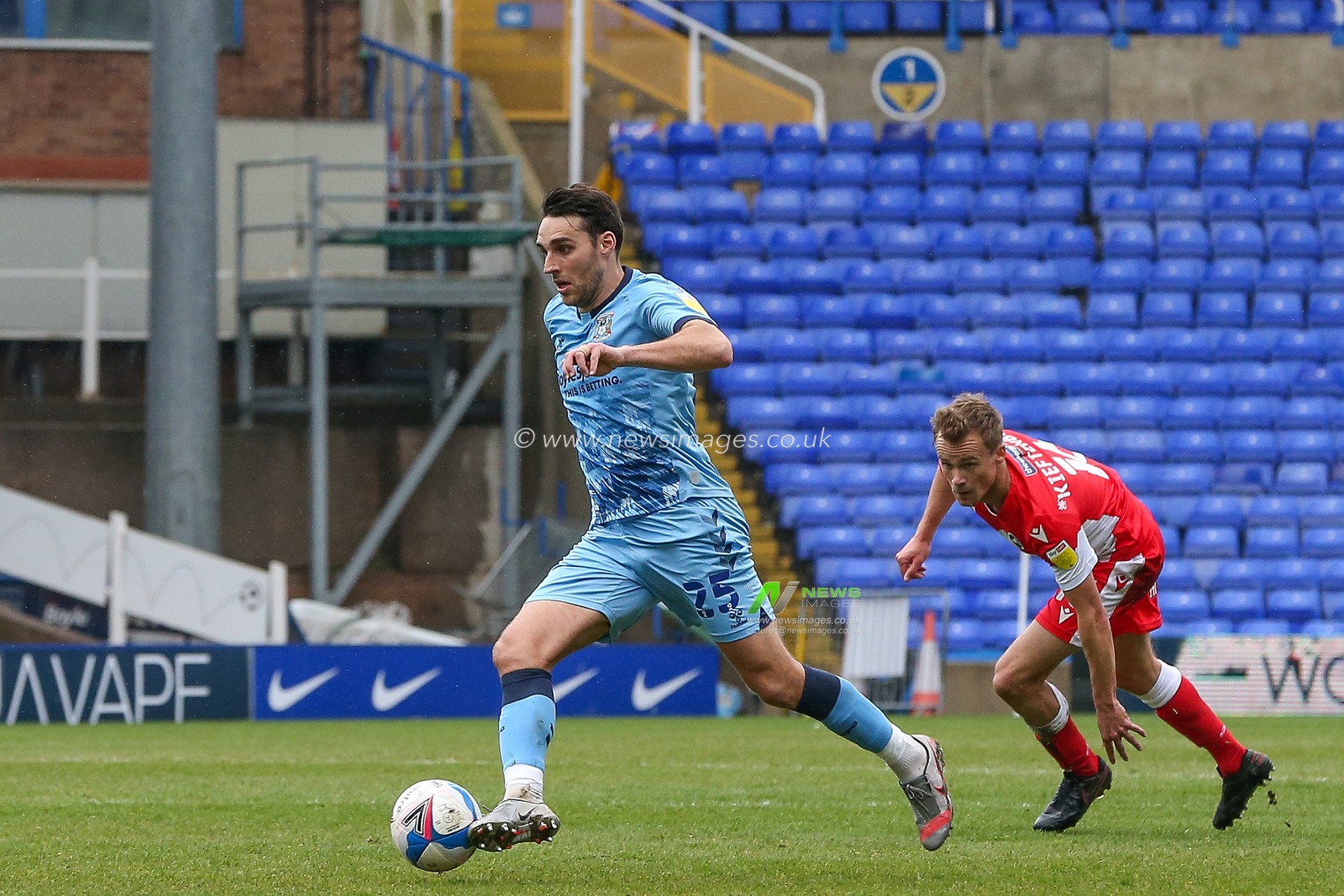 Matthew James #25 of Coventry City dribbles the ball whilst under pressure from Maikel Kieftenbeld #16 of Milwall