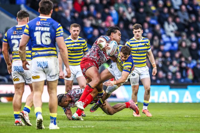 Cai Taylor-Wray of Warrington Wolves is tackled by Joe Ofahengaue of Leigh Leopards during the Betfred Challenge Cup Quarter Final match Warrington Wolves vs Leigh Leopards at The Halliwell Jones Stadium, Warrington, United Kingdom on 11 April 2026

(Photo by Alfie Cosgrove/News Images)