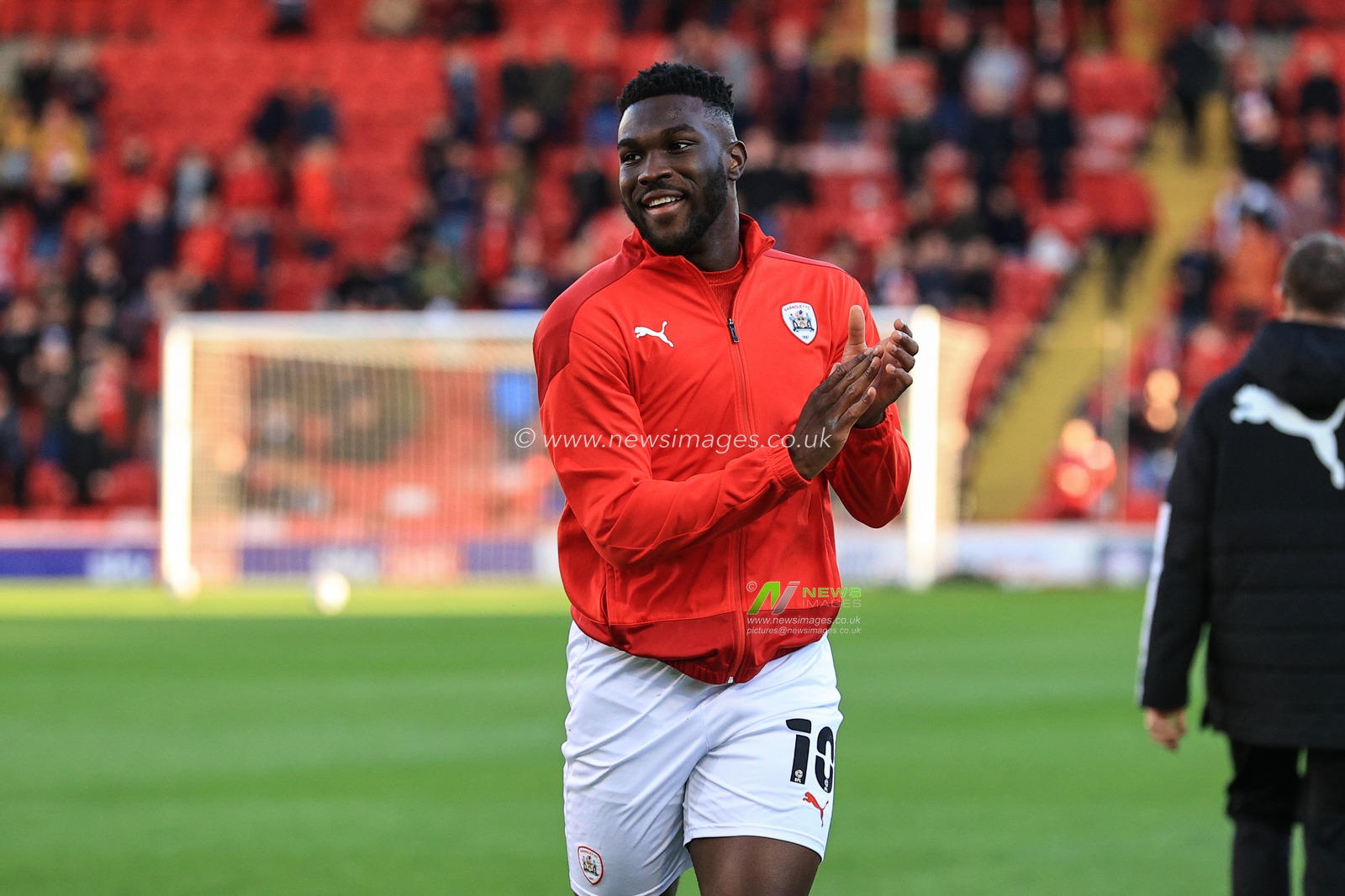 Daryl Dike #10 of Barnsley applauds the Barnsley fans as they meet for the first time