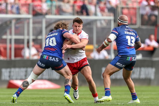 Tom Davies of Hull KR is tackled by Ky Rodwell of Wakefield Trinity and Jazz Tevaga of Wakefield Trinity during the Betfred Super League round 18 match Hull KR vs Wakefield Trinity at Sewell Group Craven Park, Hull, United Kingdom on 11 July 2026

(Photo by Alfie Cosgrove/News Images)