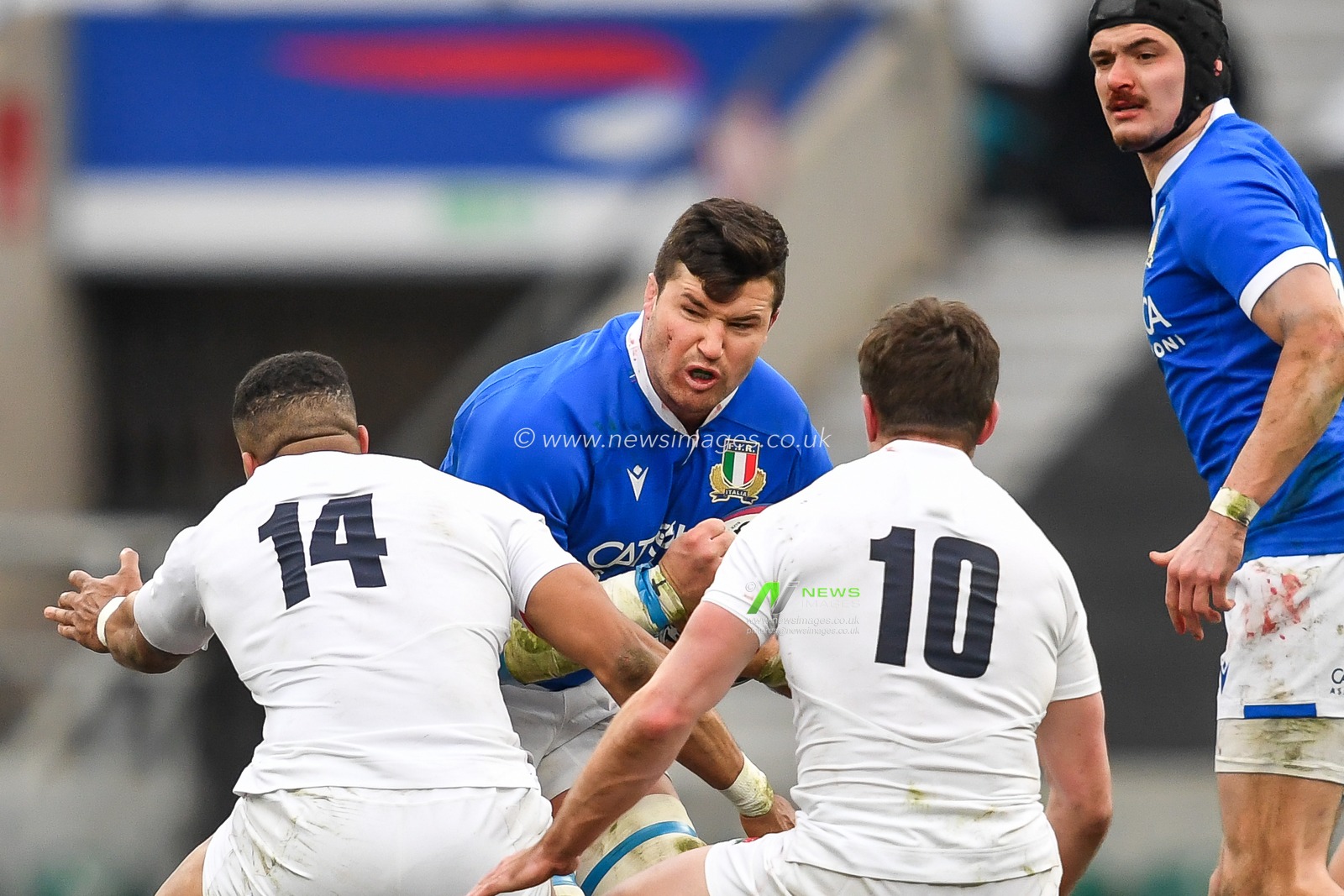 Johan Meyer of Italy is tackled by Anthony Watson of England