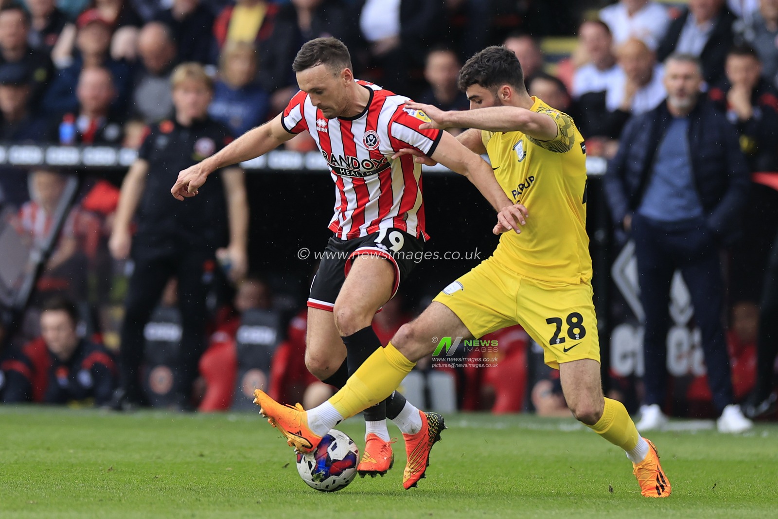 Jack Robinson #19 of Sheffield United and Thomas Cannon #28 of Preston North End challenge for the ball during the Sky Bet Championship match Sheffield United vs Preston North End at Bramall Lane, Sheffield, United Kingdom, 29th April 2023

(Photo by Conor Molloy/News Images)