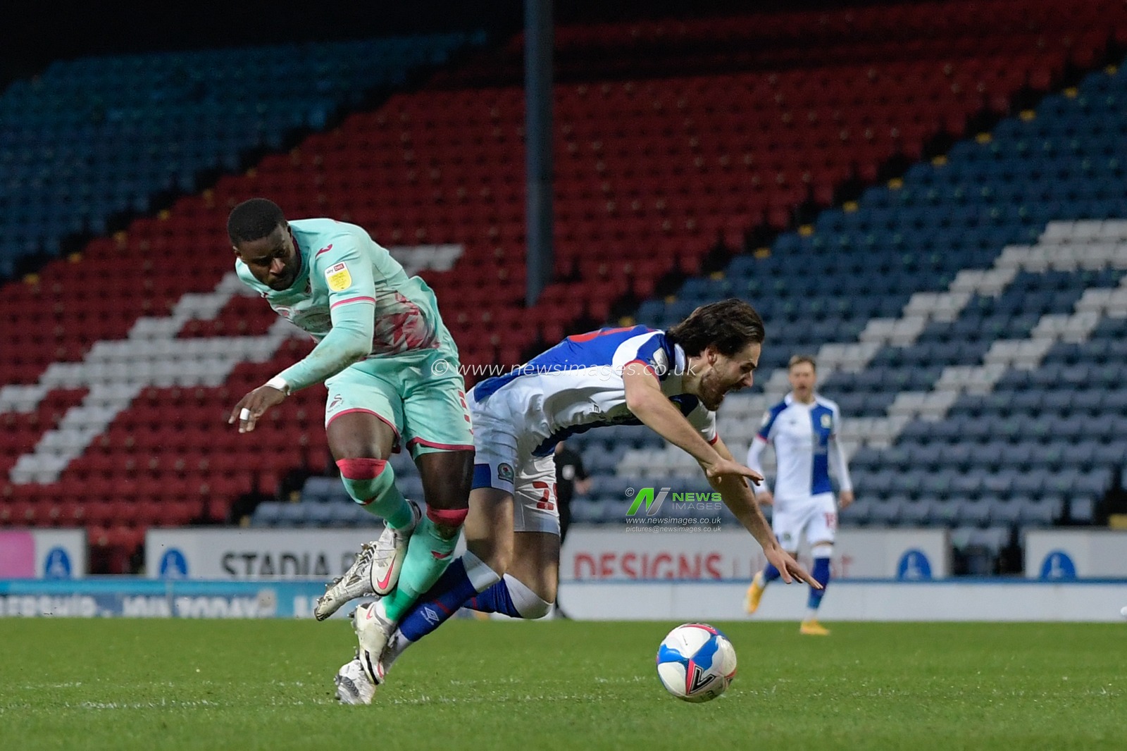 Marc Guehi #5 of Swansea City challenges Ben Brereton #20 of Blackburn Rovers for the ball in the penalty box