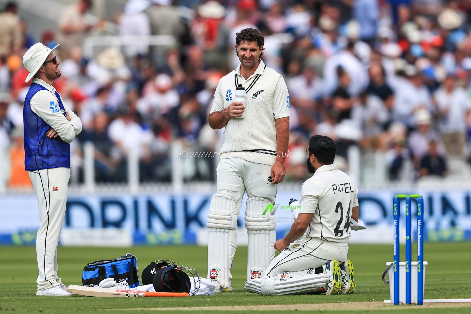 Colin De Grandhomme and Ajaz Patel of New Zealand chat during a break in play