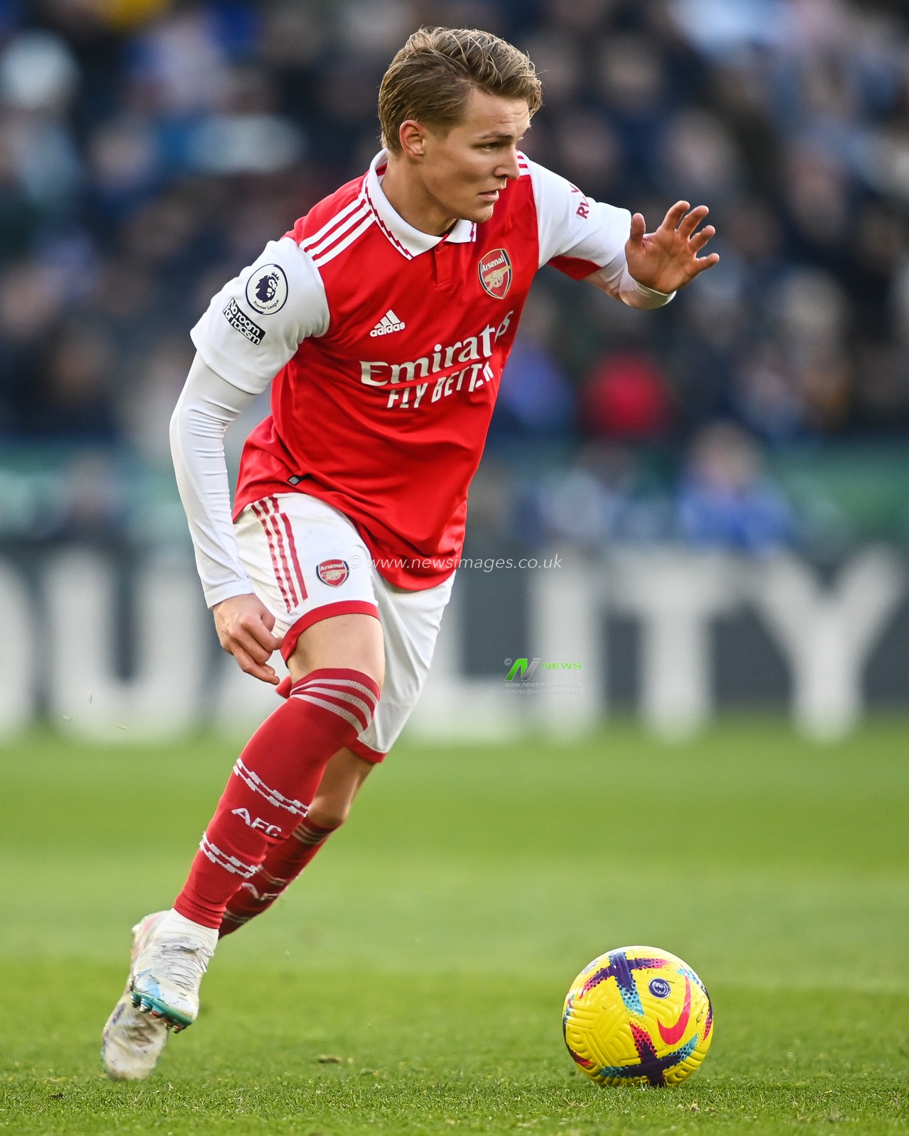 Martin Ã˜degaard #8 of Arsenal makes a break with the ball  during the Premier League match Leicester City vs Arsenal at King Power Stadium, Leicester, United Kingdom, 25th February 2023

(Photo by Craig Thomas/News Images)