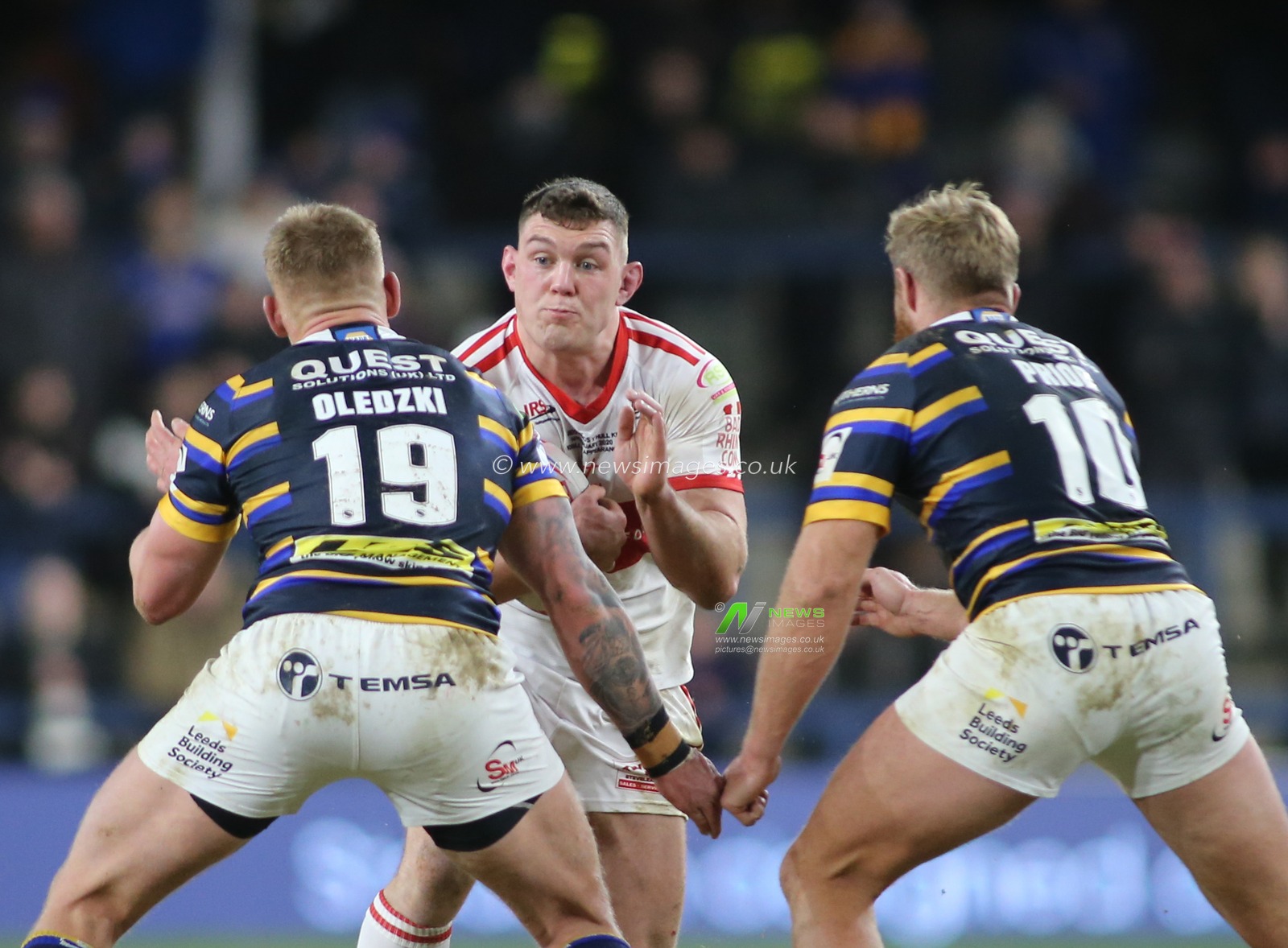 14th February 2020, Headingley Carnegie Stadium, Leeds, England; Betfred Super League, Leeds Rhinos v Hull Kingston Rovers : Robbie Mulhern (C) of Hull KR tackled by Mikolaj Oledzki (L) and Matt Prior (R) of Leeds Rhinos.