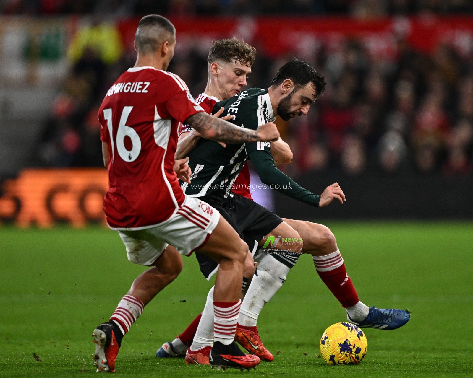 Bruno Fernandes of Manchester United is tackled by Ryan Yates of Nottingham Forest during the Premier League match Nottingham Forest vs Manchester United at City Ground, Nottingham, United Kingdom, 30th December 2023

(Photo by Craig Thomas/News Images)
