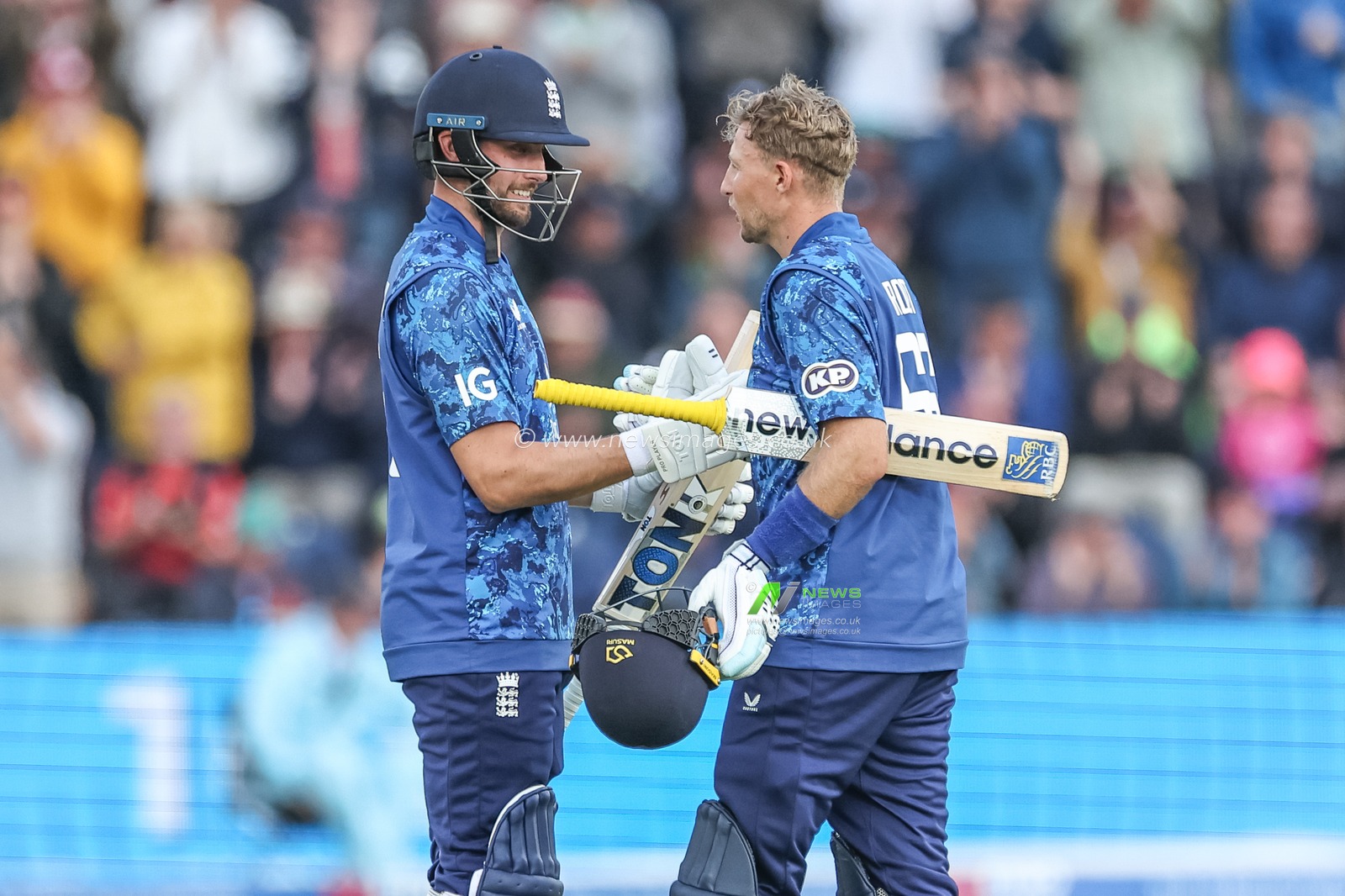 Joe Root of England celebrates a century with Will Jacks of England during the 2nd Metro Bank ODI England v West Indies at Sophia Gardens Cricket Ground, Cardiff, United Kingdom, 1st June 2025

(Photo by Mark Cosgrove/News Images)