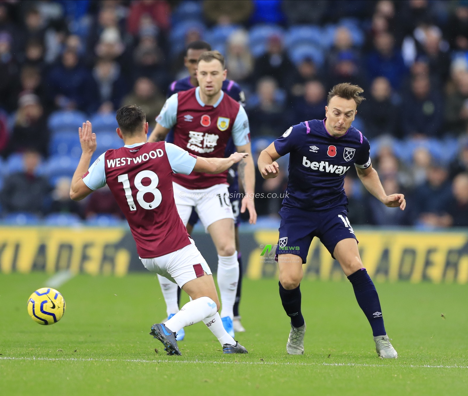 9th November 2019, Turf Moor, Burnley, England; Premier League, Burnley v West Ham United : Ashley Westwood (18) of Burnley and Mark Noble (16) of West Ham United challenge for the ball

Credit: Conor Molloy/News Images