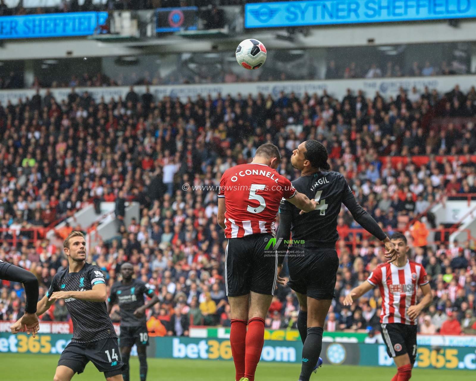 28th September 2019, Bramall Lane, Sheffield, England; Premier League, Sheffield United v Liverpool : Virgil van Dijk (4) of Liverpool heads clears from a corner 

Credit: Mark Cosgrove/News Images