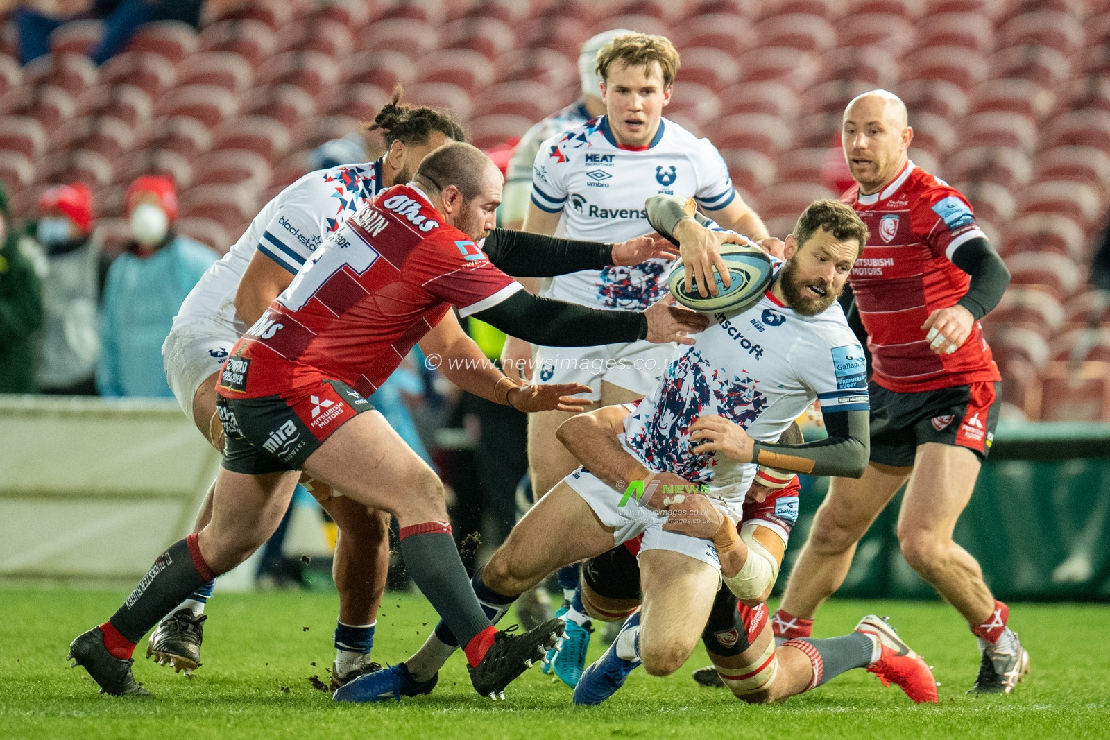 LUKE MORAHAN #14 of Bristol Bears is bought down under a number of challenges from the Gloucester Rugby players