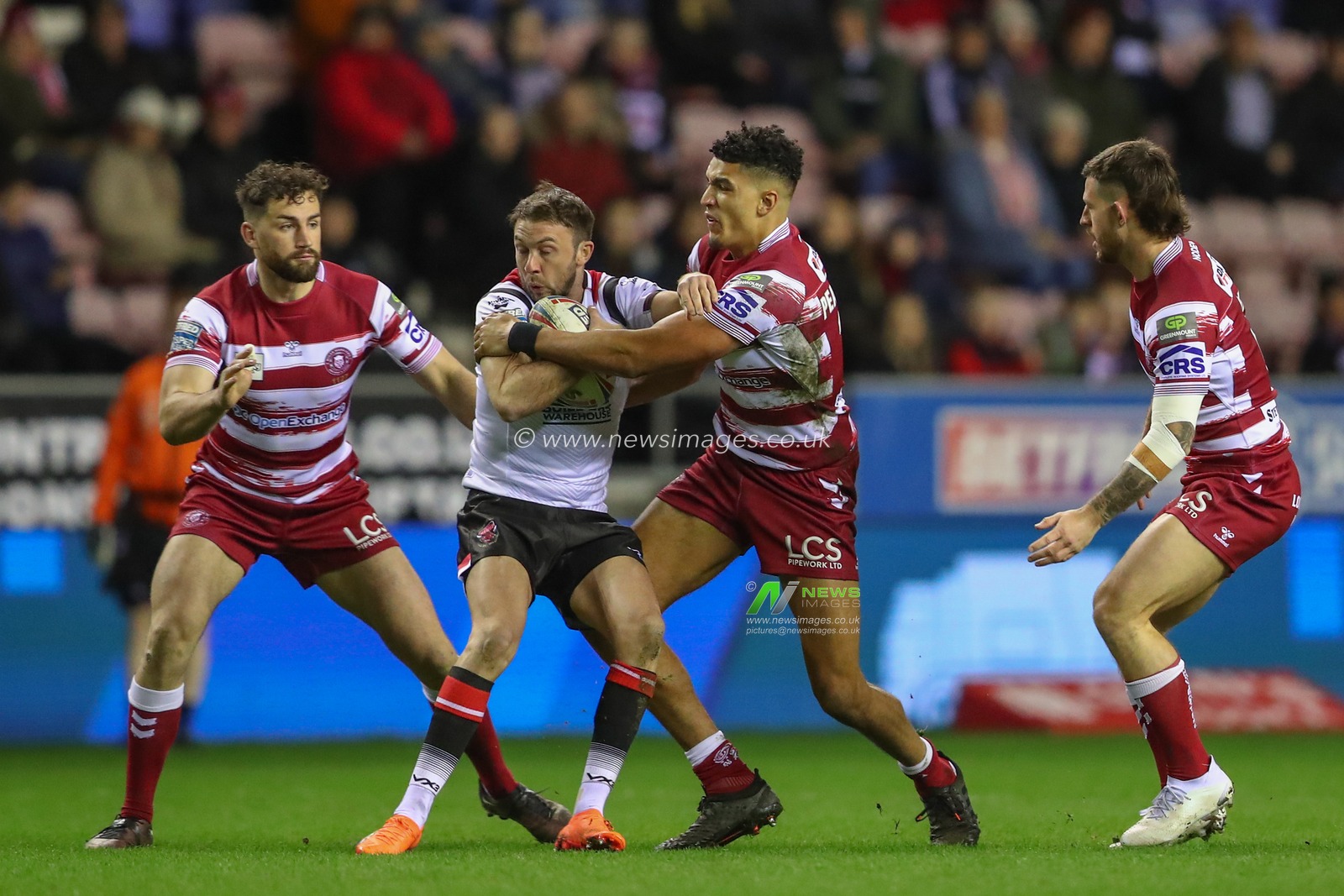 Kai Pearce-Paul #17 of Wigan Warriors tackles Ryan Brierley #1 of Salford Red Devils during the Betfred Super League match Wigan Warriors vs Salford Red Devils at DW Stadium, Wigan, United Kingdom, 24th March 2023

(Photo by Gareth Evans/News Images)