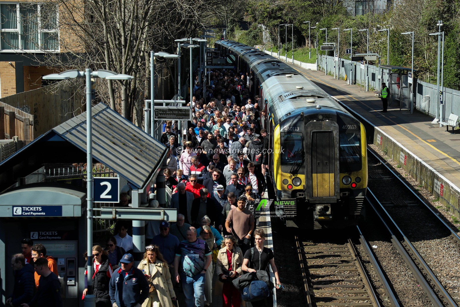 Fans arrives at Kew Bridge Station prior to the Premier League match Brentford vs Chelsea at The Gtech Community Stadium, London, United Kingdom, 6th April 2025

(Photo by Izzy Poles/News Images)