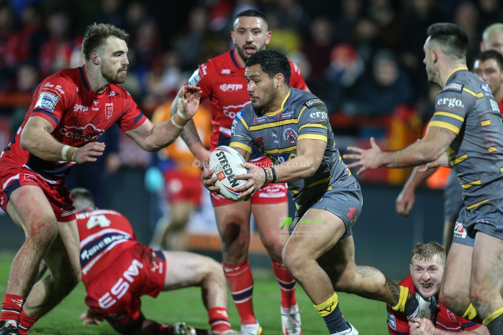 Bureta Faraimo #5 of Castleford Tigers runs at the Hull KR defence