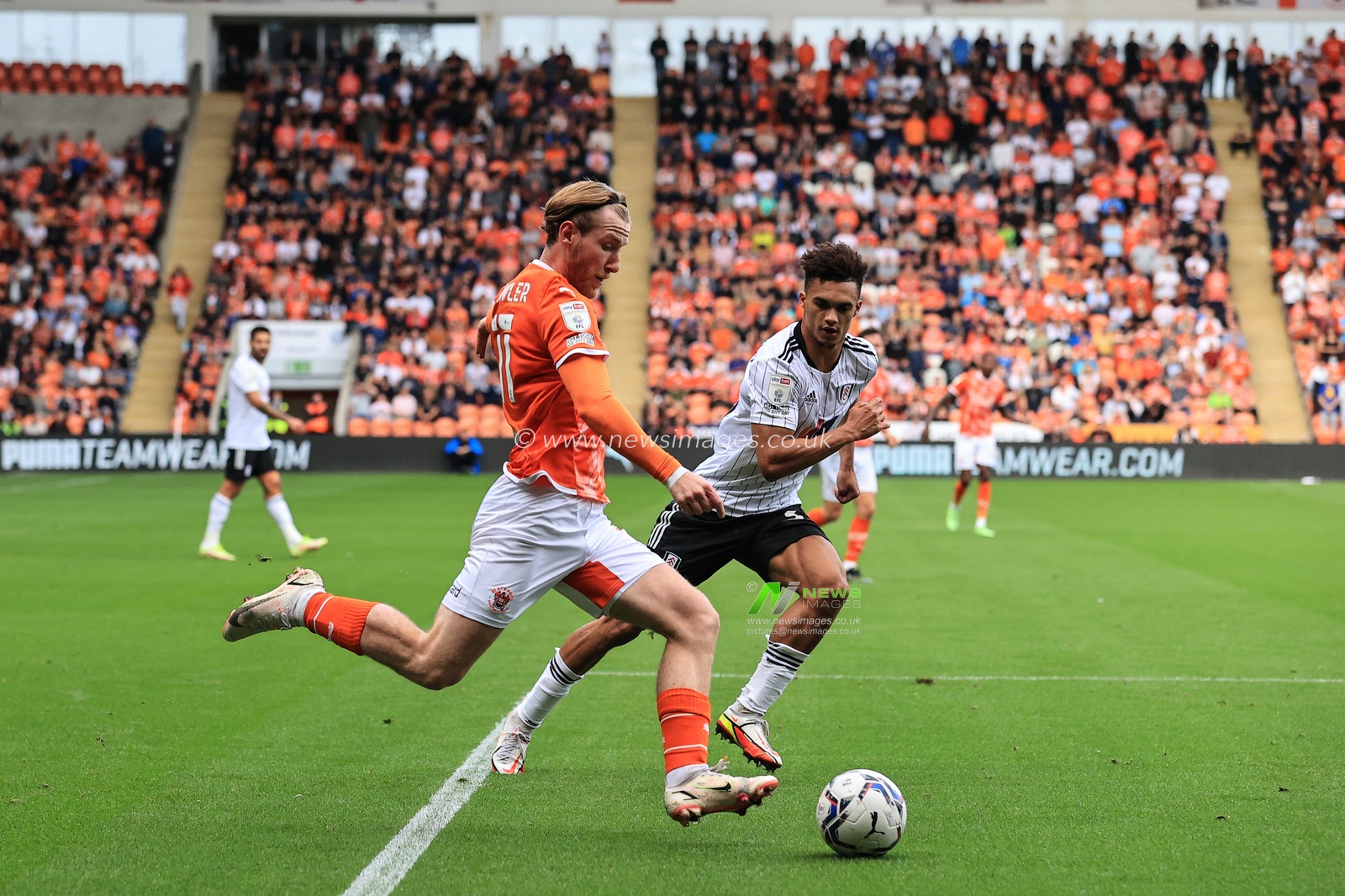 Josh Bowler #11 of Blackpool crosses the ball
