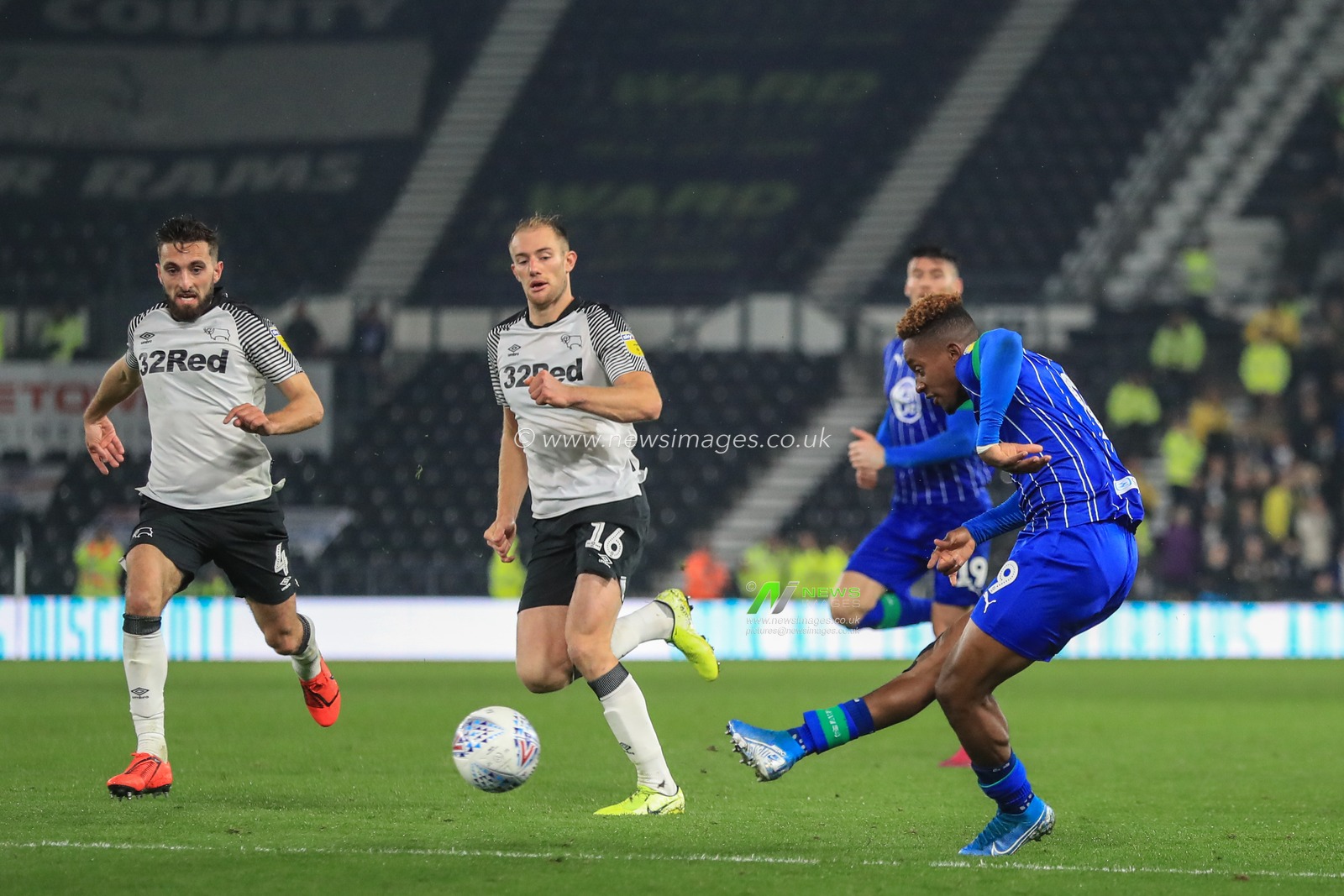 23rd October 2019, Pride Park Stadium, Derby, England; Sky Bet Championship, Derby County v Wigan Athletic : Gavin Massey (11) of Wigan Athletic shoots on goal and Kelle Roos (21) of Derby County makes a save

Credit: Mark Cosgrove/News Images