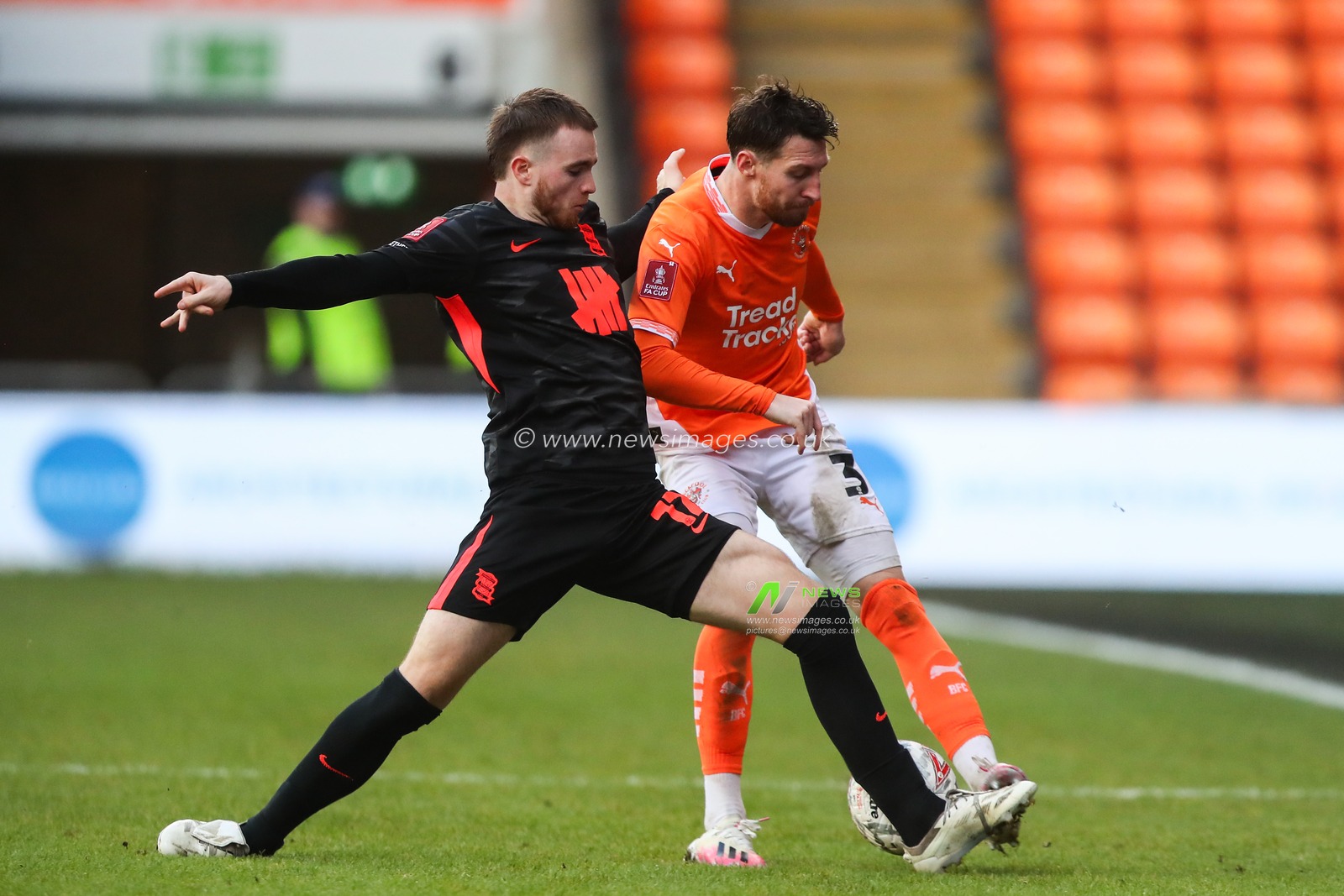 Marc Leonard of Birmingham City tackles James Husband of Blackpool during the Emirates FA Cup 2nd Round match Blackpool vs Birmingham City at Bloomfield Road, Blackpool, United Kingdom, 1st December 2024

(Photo by Gareth Evans/News Images)