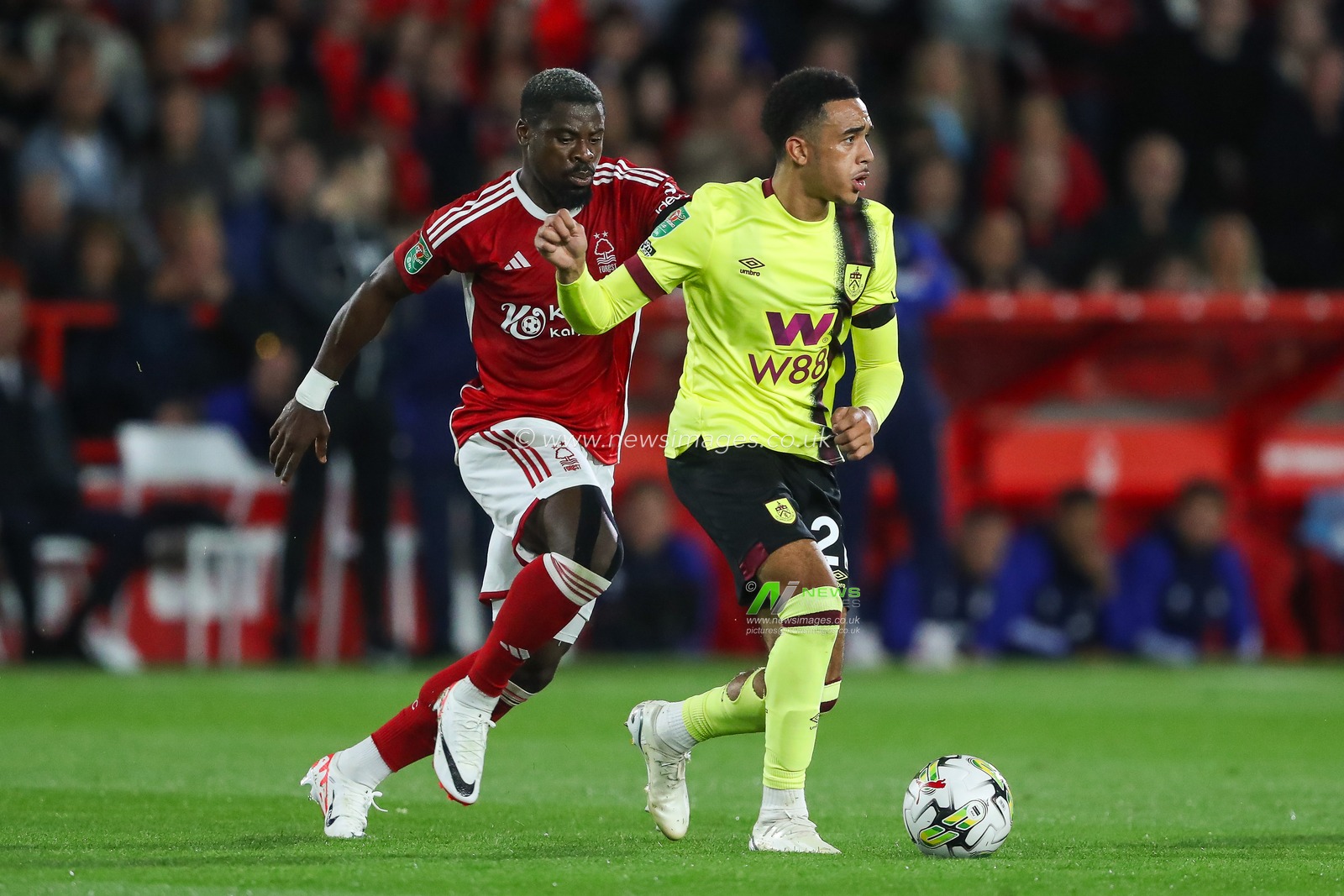 Aaron Ramsey #21 of Burnley holds off Serge Aurier #24 of Nottingham Forest during the Carabao Cup match Nottingham Forest vs Burnley at City Ground, Nottingham, United Kingdom, 30th August 2023

(Photo by Gareth Evans/News Images)