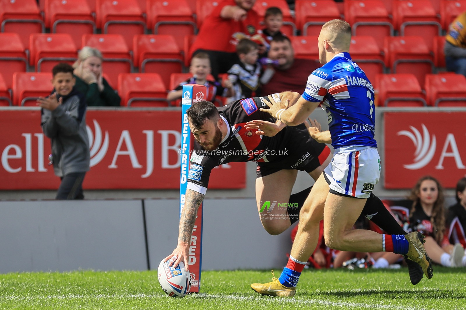 16th June 2019 ,  AJ Bell Stadium, Salford, England;  Betfred Super League, Round 18, Salford Red Devils vs Wakefield Trintiny ; Jake Bibby (5) of Salford Red Devils goes over for his second try 

Credit: Mark Cosgrove/News Images