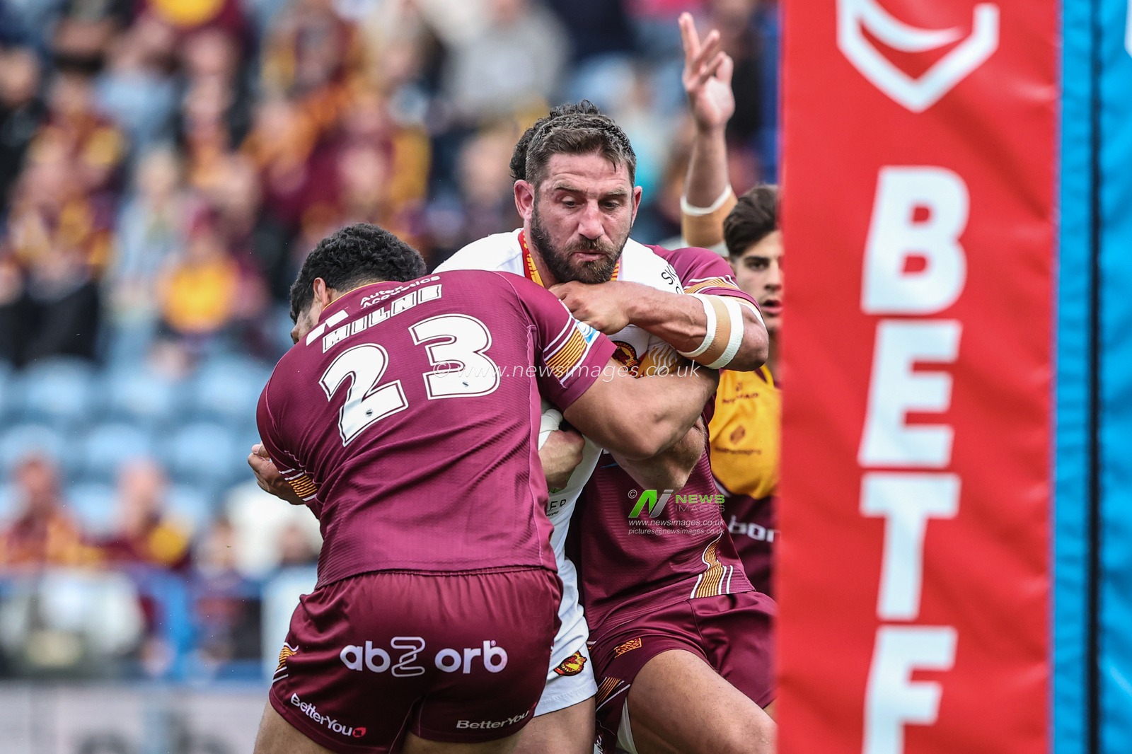Julian Bousquet of Catalan Dragons is tackled by Taane Milne of Huddersfield Giants during the Betfred Super League match Huddersfield Giants vs Catalans Dragons at John Smith's Stadium, Huddersfield, United Kingdom, 13th April 2025

(Photo by Alfie Cosgrove/News Images)