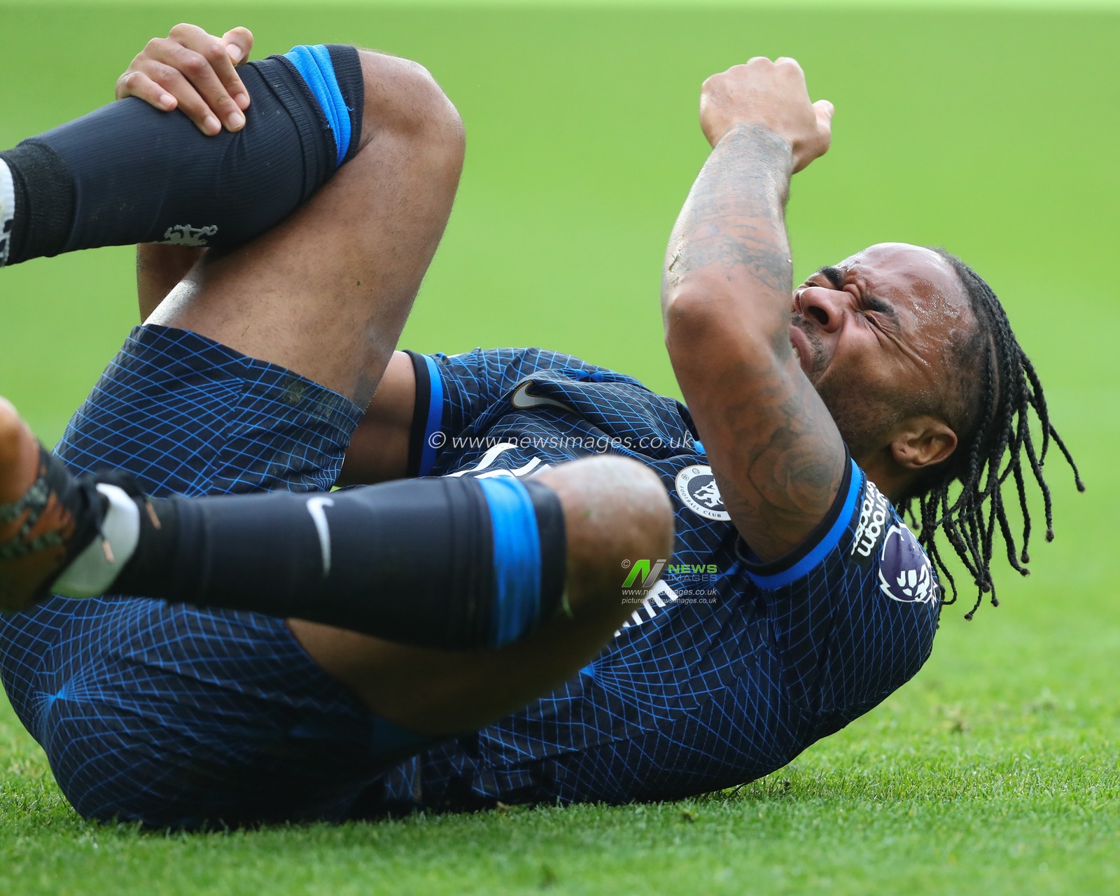 Raheem Sterling of Chelsea goes down injured, during the Premier League match Wolverhampton Wanderers vs Chelsea at Molineux, Wolverhampton, United Kingdom, 24th December 2023

(Photo by Gareth Evans/News Images)