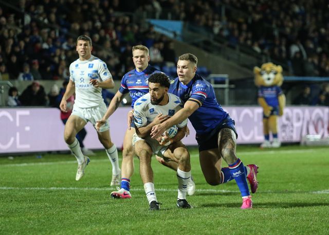 Benjamin Laguerre of Toulouse Olympique is tackled by Cameron Scott of Wakefield Trinity during the Betfred Super League Round 1 match Wakefield Trinity vs Toulouse Olympique at DIY Kitchens Stadium, Wakefield, United Kingdom on 14 February 2026

(Photo by Richard Bierton/News Images)