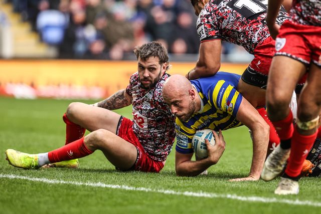 James Harrison of Warrington Wolves is tackled by Matt Davis of Leigh Leopards during the Betfred Super League round 7 match Warrington Wolves vs Leigh Leopards at The Halliwell Jones Stadium, Warrington, United Kingdom on 04 April 2026

(Photo by Alfie Cosgrove/News Images)