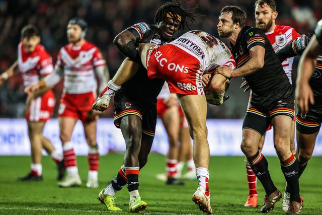 David Klemmer of St Helens is tackled by Joe Mellor of Bradford Bulls and Eribe Doro of Bradford Bulls during the Betfred Super League round 4 match St Helens vs Bradford Bulls at The BrewDog Stadium, St Helens, United Kingdom on 07 March 2026

(Photo by Alfie Cosgrove/News Images)