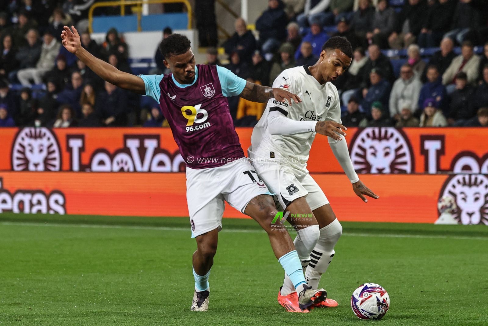 Lyle Foster of Burnley and Morgan Whittaker of Plymouth Argyle battle for the ball during the Sky Bet Championship match Burnley vs Plymouth Argyle at Turf Moor, Burnley, United Kingdom, 1st October 2024

(Photo by Alfie Cosgrove/News Images)