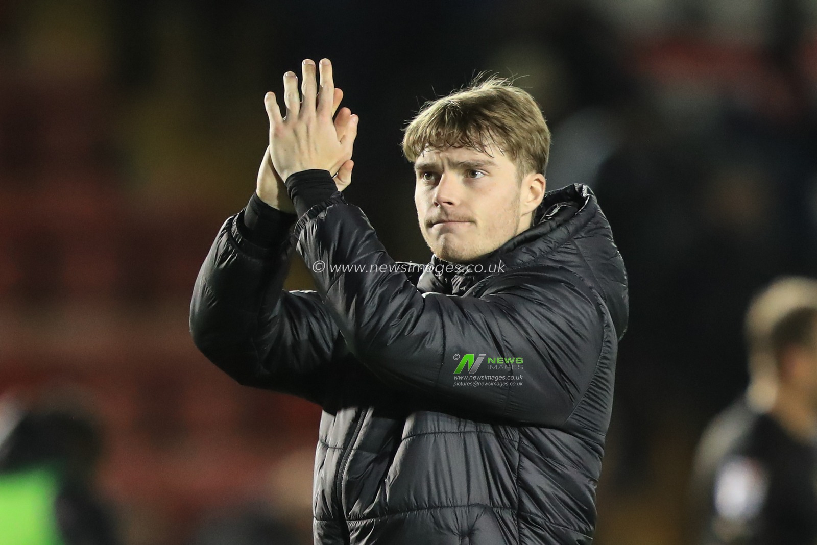 Luca Connell #48 of Barnsley applauds the travelling fans during the Sky Bet League 1 match Lincoln City vs Barnsley at Gelder Group Sincil Bank Stadium, Lincoln, United Kingdom, 25th November 2023

(Photo by Alfie Cosgrove/News Images)
