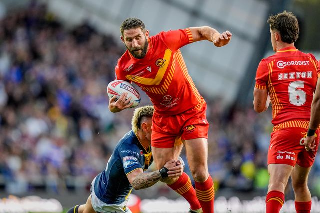 Julian Bousquet of Catalans Dragons is tackled by Danny Levi of Leeds Rhinos during the Betfred Super League round 9 match Leeds Rhinos vs Catalans Dragons at AMT Headingley Stadium, Leeds, United Kingdom on 24 April 2026

(Photo by Maynard Manyowa/News Images)