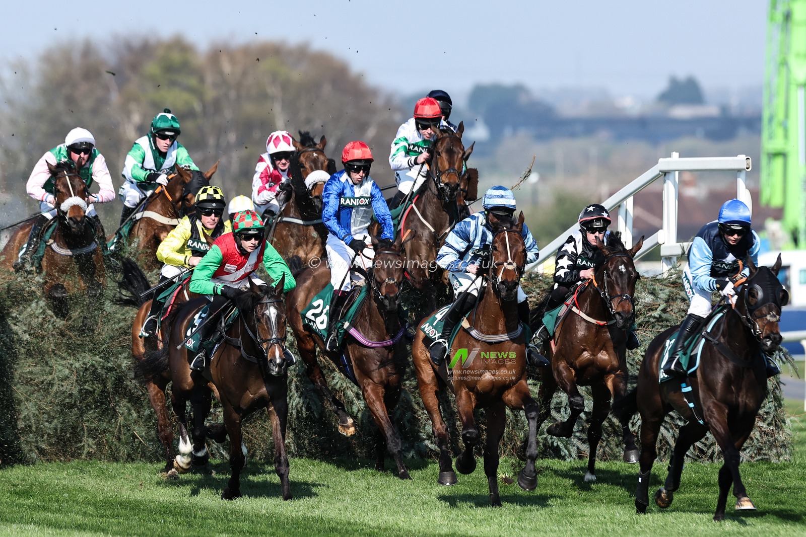 Horses clear the first fence in the Randox Foxhunters' Open Hunters' Chase during the Randox Grand National 2025 Day 1 Opening Day at Aintree Racecourse, Liverpool, United Kingdom, 3rd April 2025

(Photo by Mark Cosgrove/News Images)