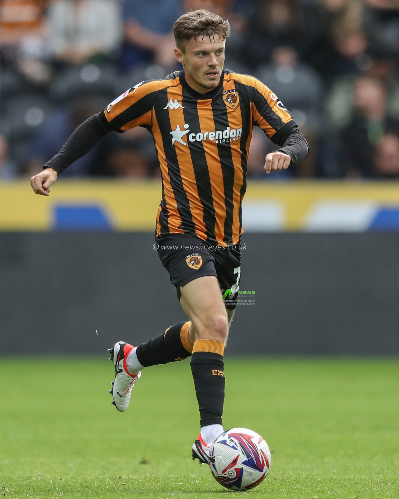 Regan Slater of Hull City breaks with the ball during the Sky Bet Championship match Hull City vs Millwall at MKM Stadium, Hull, United Kingdom, 24th August 2024

(Photo by Alfie Cosgrove/News Images)