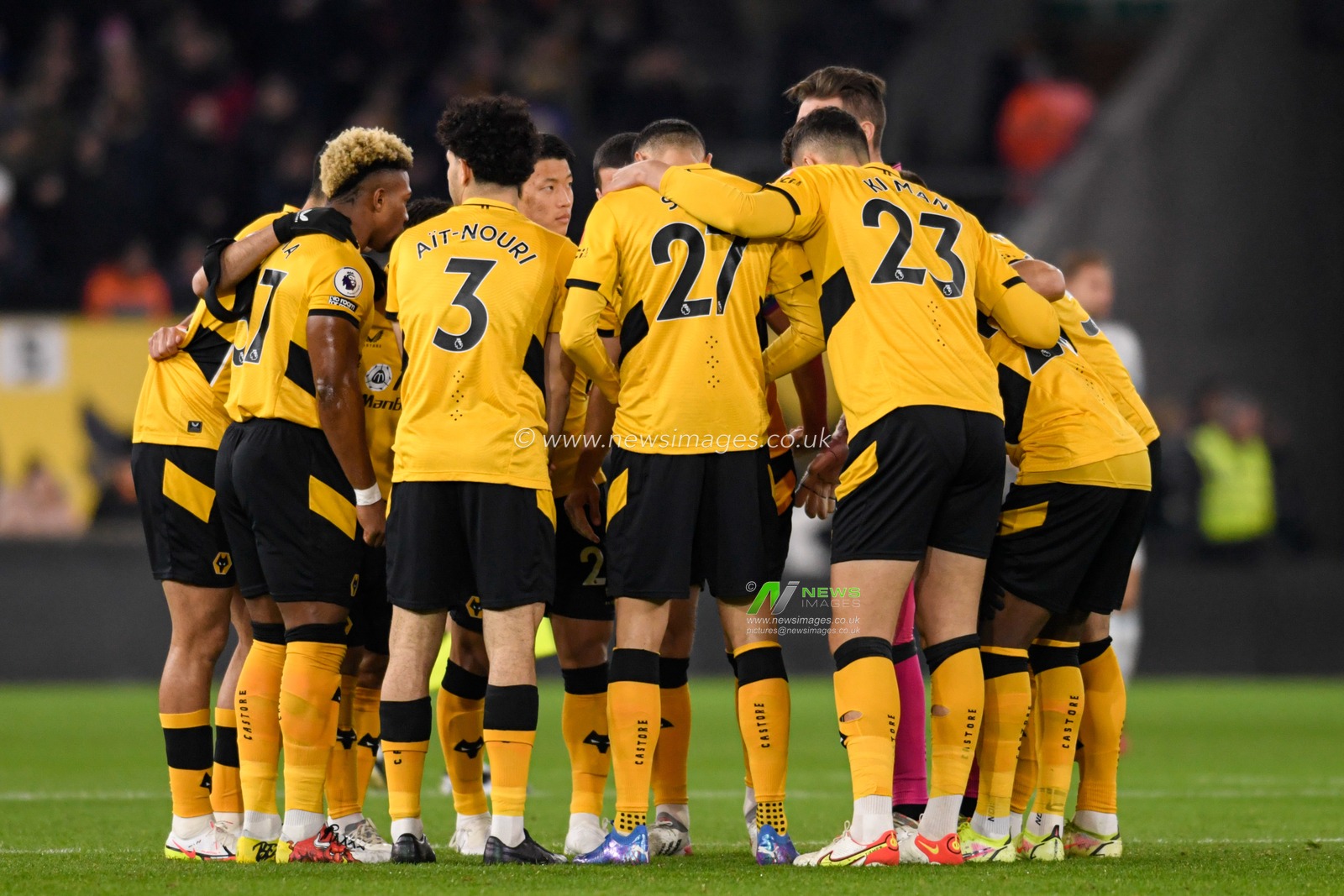 The Wolverhampton Wanderers players form a huddle before the game