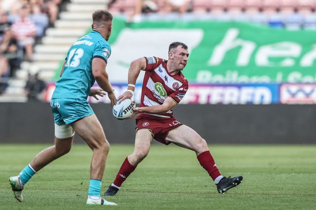 Adam Clune of Huddersfield Giants passes the ball during the Betfred Super League round 18 match Wigan Warriors vs Huddersfield Giants at The Brick Community Stadium, Wigan, United Kingdom, 11th July 2025

(Photo by Alfie Cosgrove/News Images)