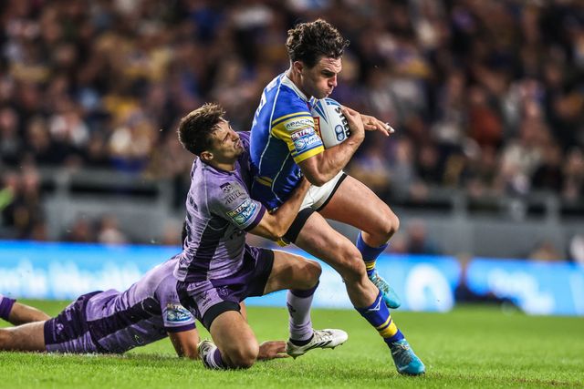 Brodie Croft of Leeds Rhinos is tackled by Tyrone May of Hull KR during the Betfred Super League round 23 match Leeds Rhinos vs Hull KR at Headingley Stadium, Leeds, United Kingdom, 21st August 2025

(Photo by Alfie Cosgrove/News Images)