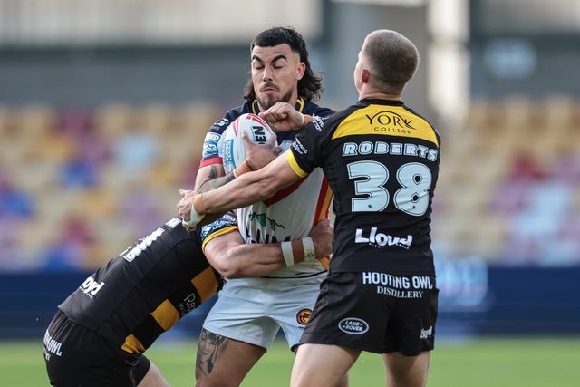 Charlie Staines of Catalans Dragons is tackled by Kieran Buchanan and Will Roberts of York Knights during the Betfred Super League round 12 match York Knights vs Catalans Dragons at LNER Community Stadium, York, United Kingdom on 23 May 2026

(Photo by Mark Cosgrove/News Images)