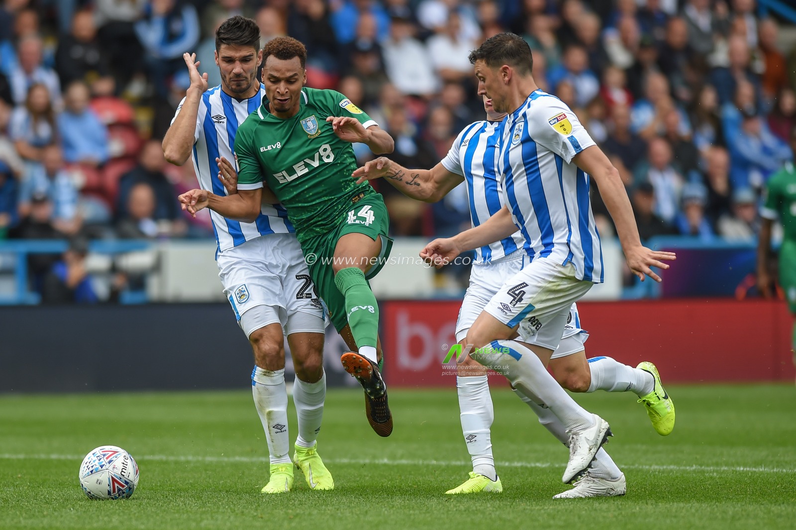 15th September 2019, John Smiths Stadium, Huddersfield England; Sky Bet Championship Football, Huddersfield Town vs Sheffield Wednesday ;Jacob Murphy (14) of Sheffield Wednesday forces his way past 

Credit: Dean Williams/News Images

English Football League images are subject to DataCo Licence