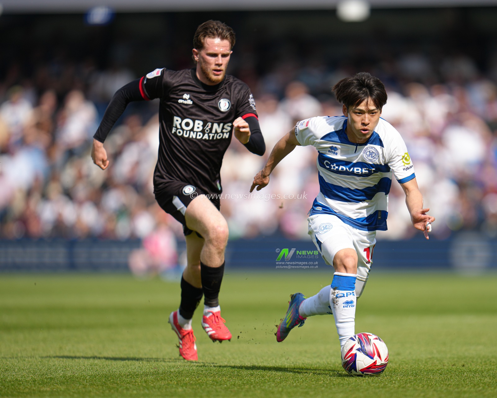 Koki Saito of Queens Park Rangers drives forward with the ball during the Sky Bet Championship match Queens Park Rangers vs Bristol City at Kiyan Prince Foundation Stadium, London, United Kingdom, 12th April 2025

(Photo by Harvey Murphy/News Images)