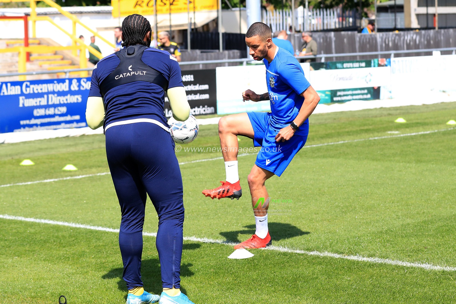 Craig Dundas #14 of Sutton United and Craig Eastmond #15 of Sutton United seen warming up prior to kick off.